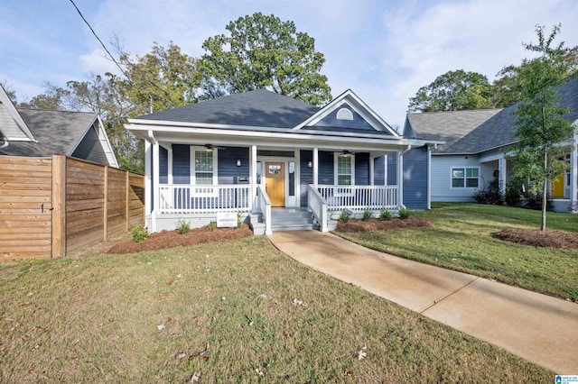 view of front of home featuring covered porch and a front yard