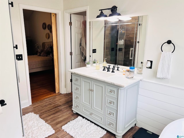 bathroom featuring vanity and hardwood / wood-style floors