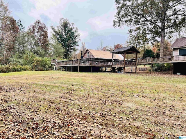 view of yard featuring a wooden deck