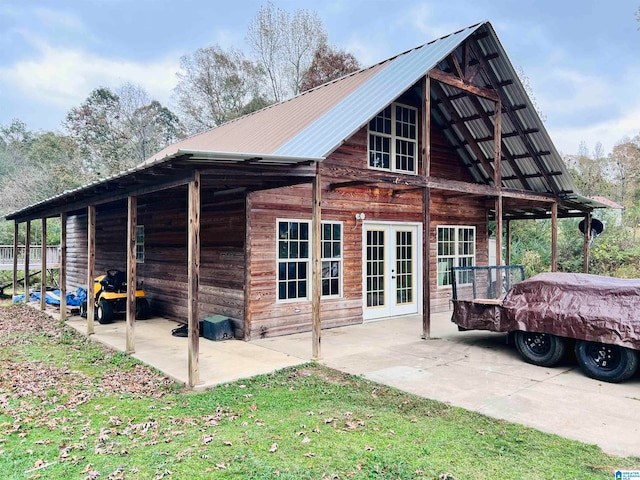 view of side of property with french doors