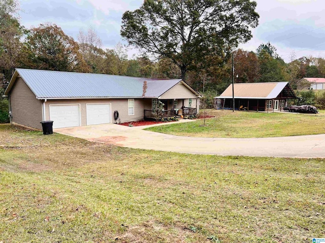 ranch-style house with a front yard, covered porch, and a garage