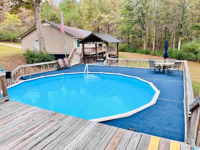 view of pool featuring a wooden deck