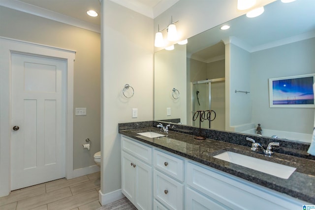 bathroom with a shower with shower door, vanity, toilet, and crown molding