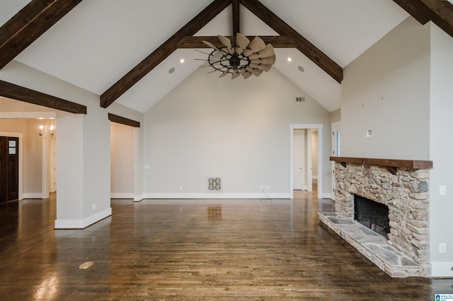 unfurnished living room featuring high vaulted ceiling, a fireplace, dark hardwood / wood-style floors, and beam ceiling