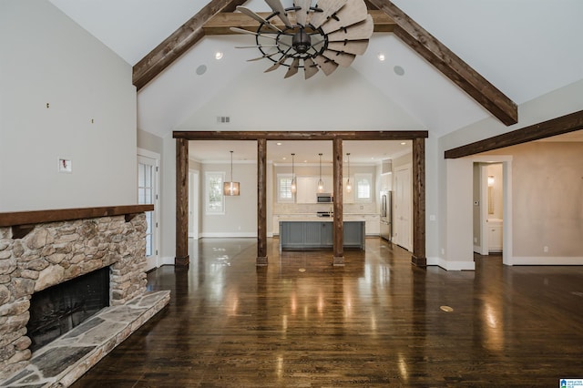 unfurnished living room featuring beamed ceiling, high vaulted ceiling, and dark hardwood / wood-style flooring