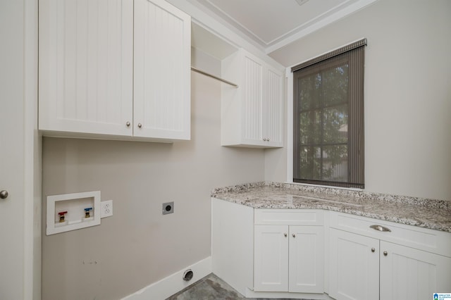 clothes washing area featuring washer hookup, cabinets, and hookup for an electric dryer