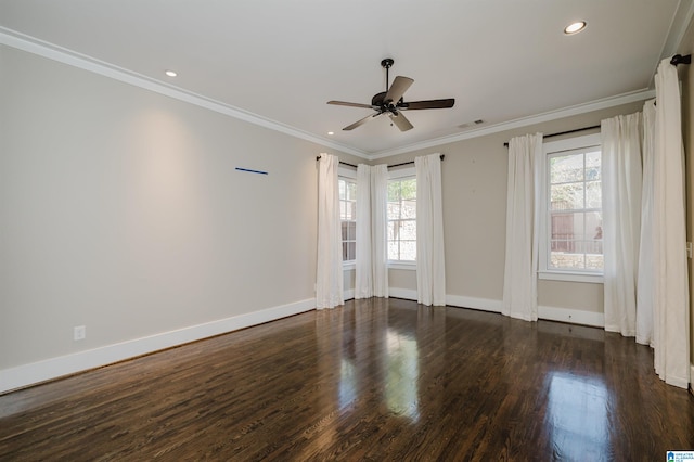 empty room with ceiling fan, dark hardwood / wood-style floors, and crown molding