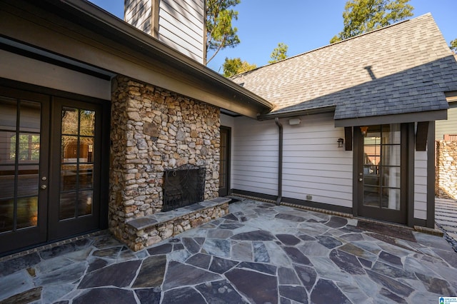 view of patio with an outdoor stone fireplace