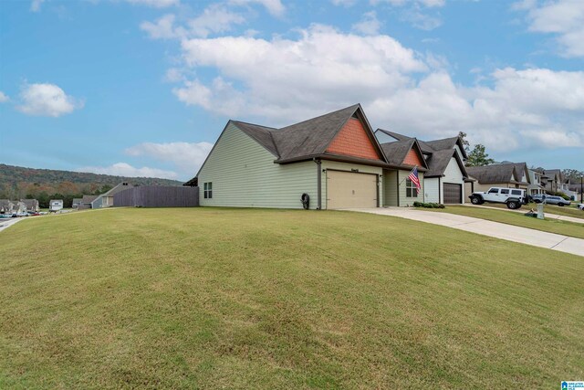 view of property exterior with a garage and a yard