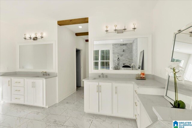 bathroom featuring vanity and a tile shower