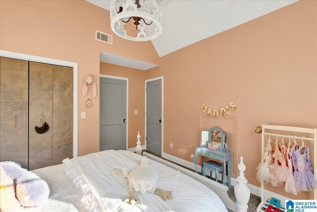 bedroom featuring a chandelier and lofted ceiling