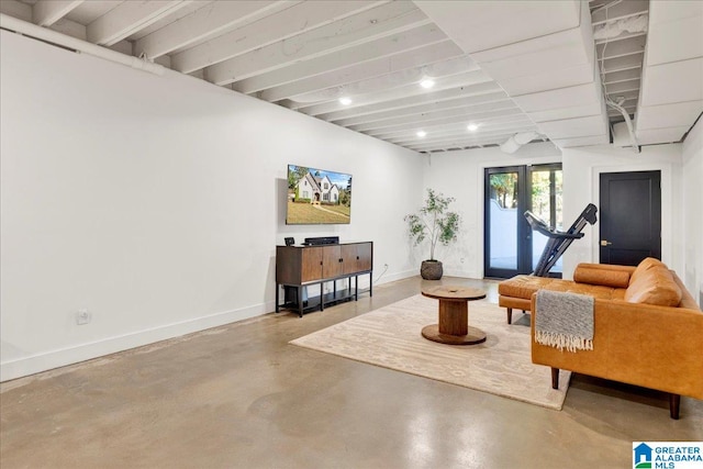 living room with concrete floors and french doors