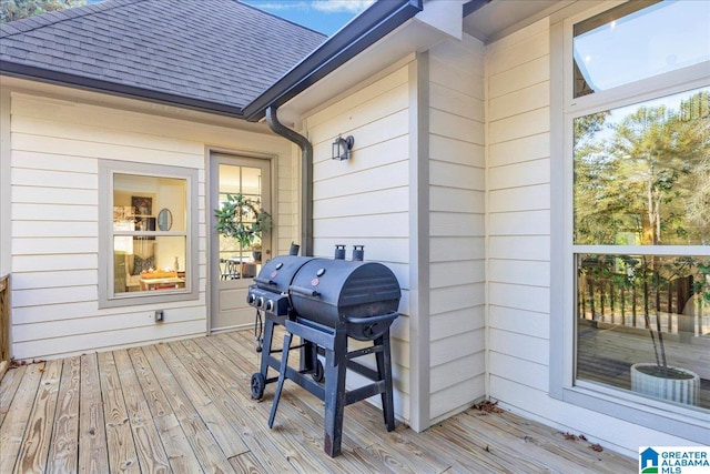 wooden deck with grilling area