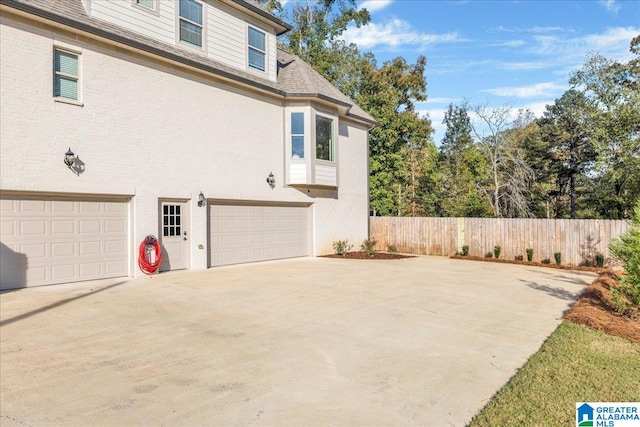 view of property exterior with a garage