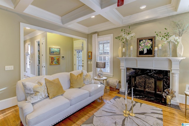 living room with a premium fireplace, hardwood / wood-style flooring, and coffered ceiling