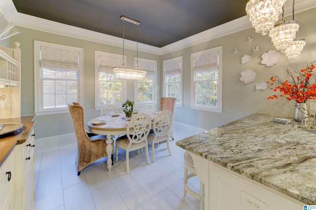 dining room with a wealth of natural light, light tile patterned floors, and ornamental molding