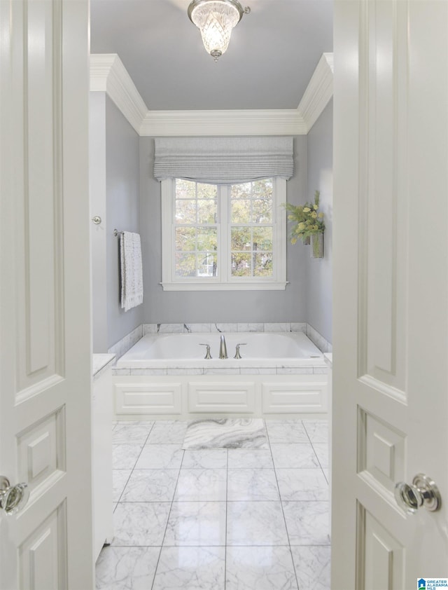 bathroom with a bath and ornamental molding