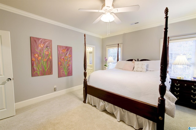 carpeted bedroom with ornamental molding and ceiling fan