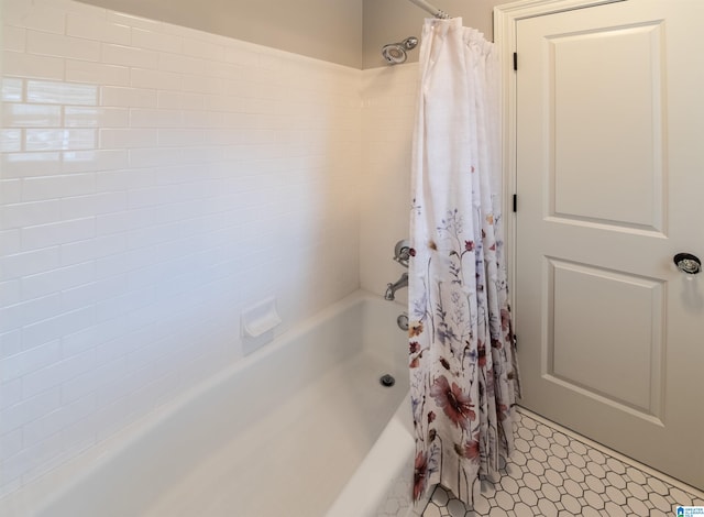 bathroom with shower / bath combo with shower curtain