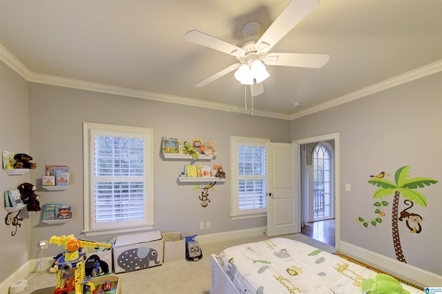 bedroom featuring ceiling fan, multiple windows, carpet, and ornamental molding