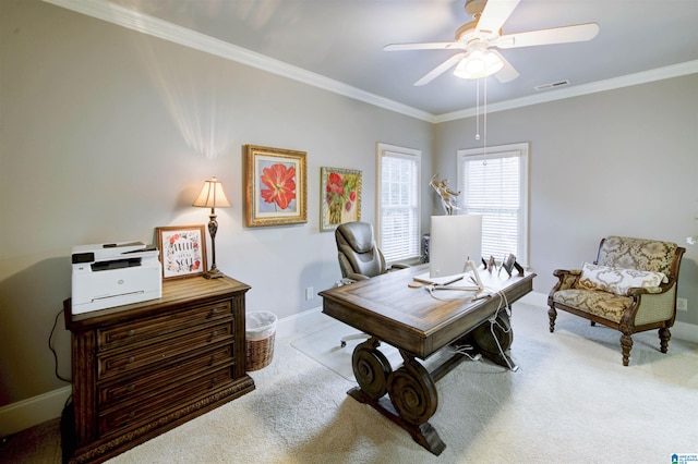 office area with ornamental molding, light colored carpet, and ceiling fan