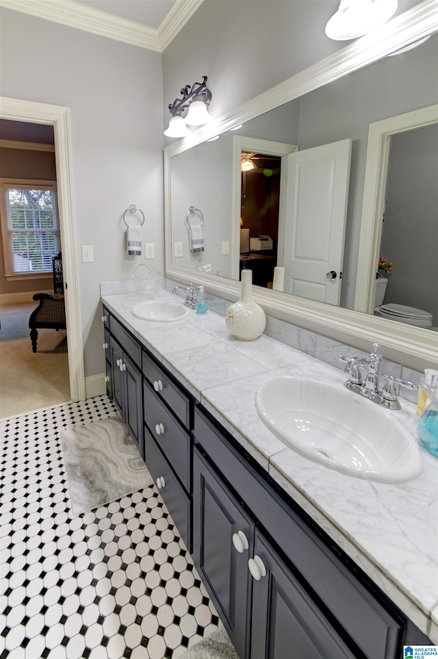 bathroom featuring vanity and ornamental molding