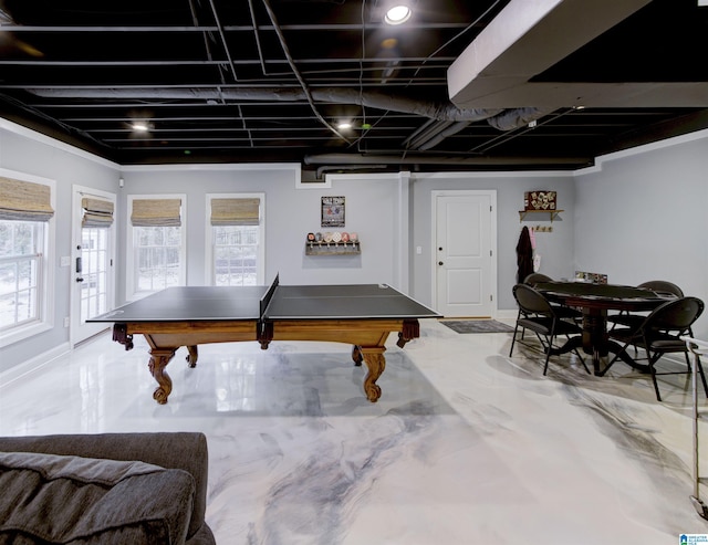 recreation room with concrete flooring