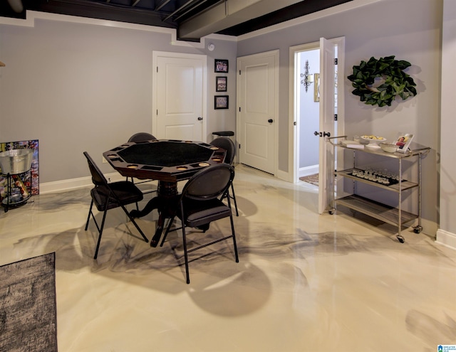 dining room featuring beamed ceiling