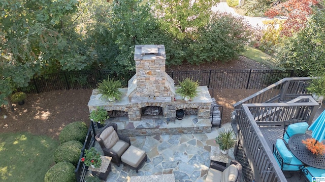 view of patio / terrace with an outdoor stone fireplace