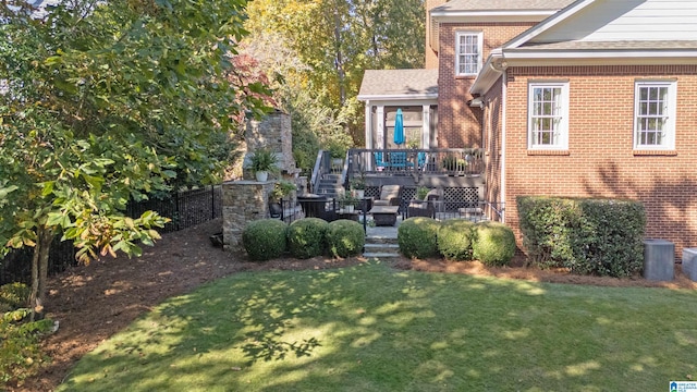 view of yard featuring a wooden deck