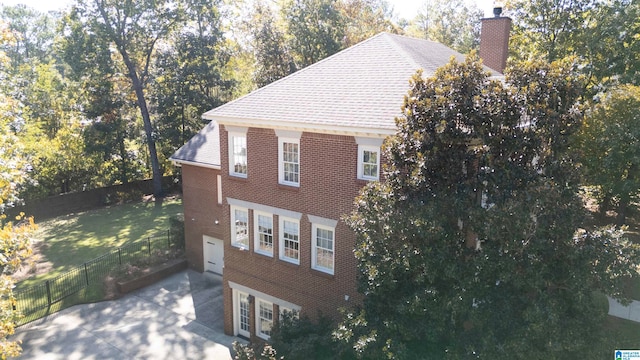 view of side of home with a garage