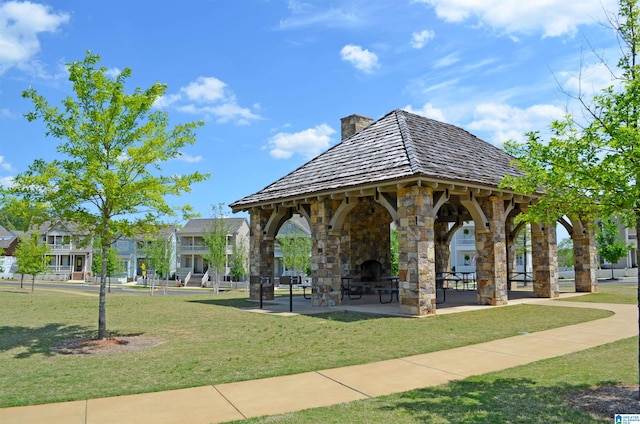 view of property's community featuring a yard and a gazebo