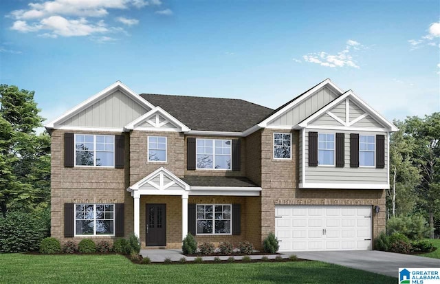 view of front of property featuring a garage and a front yard