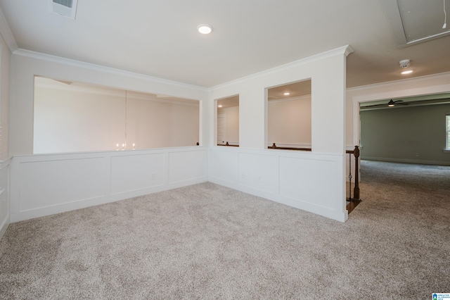 carpeted empty room with crown molding