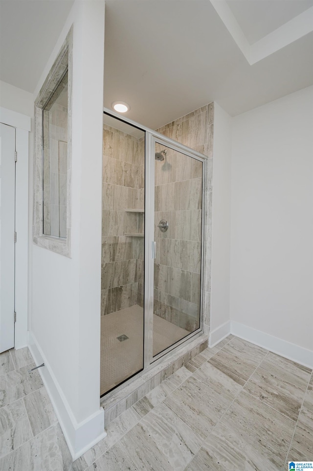 bathroom featuring an enclosed shower