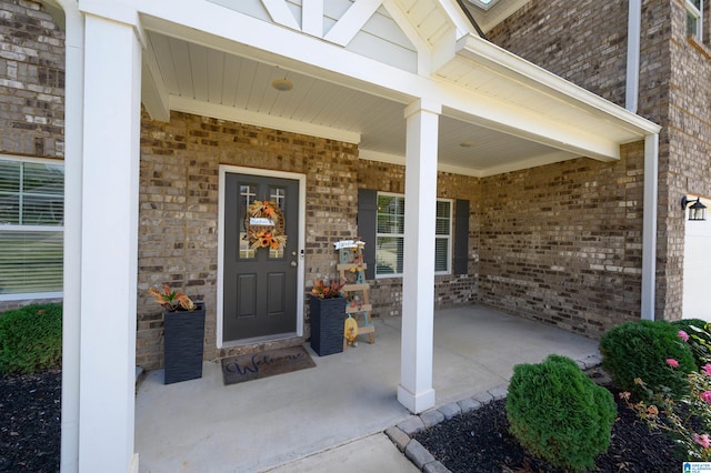 property entrance featuring a porch