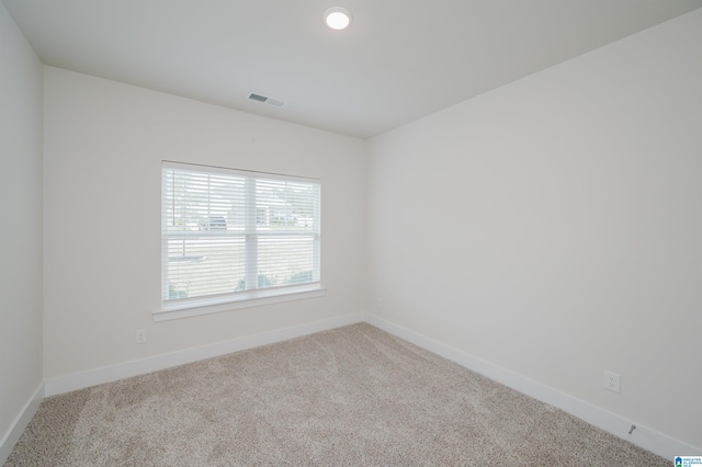 empty room with carpet flooring