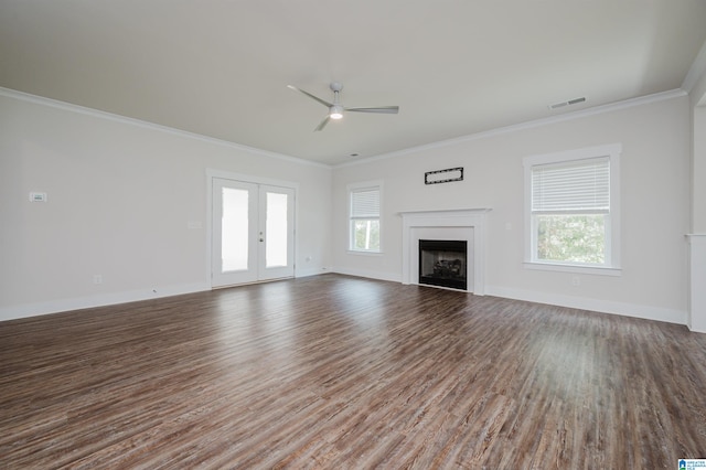 unfurnished living room with ceiling fan, french doors, hardwood / wood-style flooring, and ornamental molding