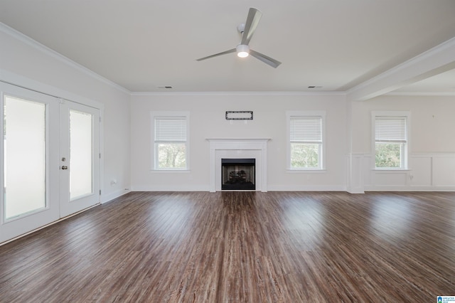 unfurnished living room featuring dark hardwood / wood-style flooring, french doors, ceiling fan, and crown molding