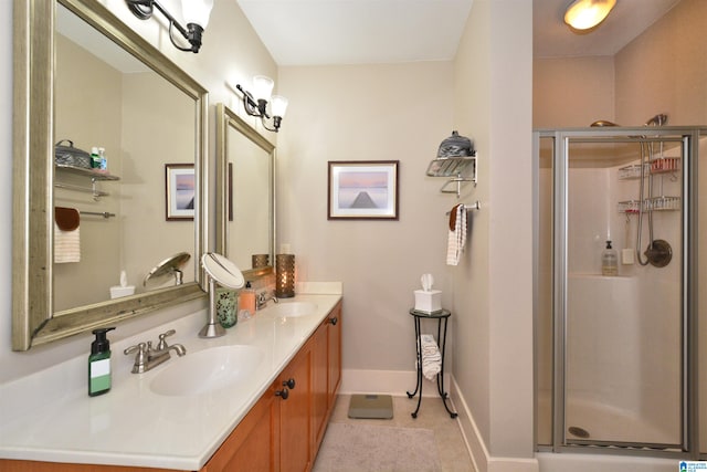 bathroom featuring walk in shower, tile patterned flooring, and vanity