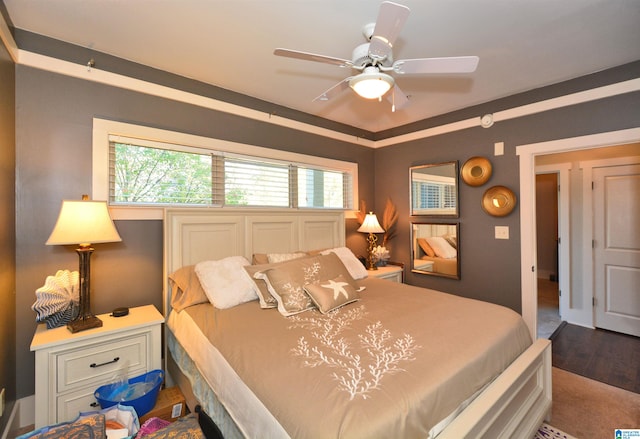 bedroom featuring ceiling fan and wood-type flooring