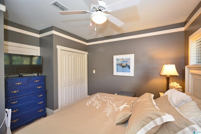 bedroom featuring ceiling fan and a closet