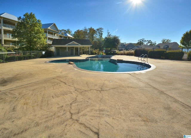 view of pool with a patio and a jacuzzi