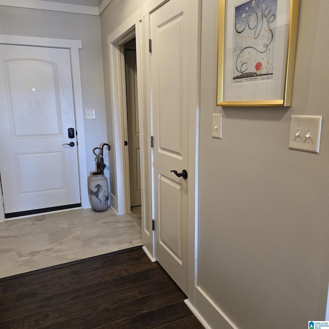 hallway featuring dark hardwood / wood-style flooring