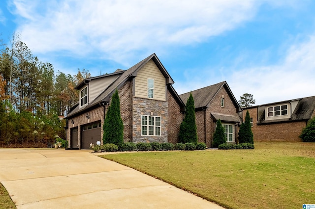 view of front of house featuring a garage and a front lawn