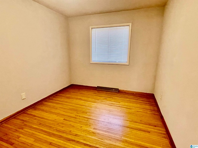 unfurnished room featuring light hardwood / wood-style floors