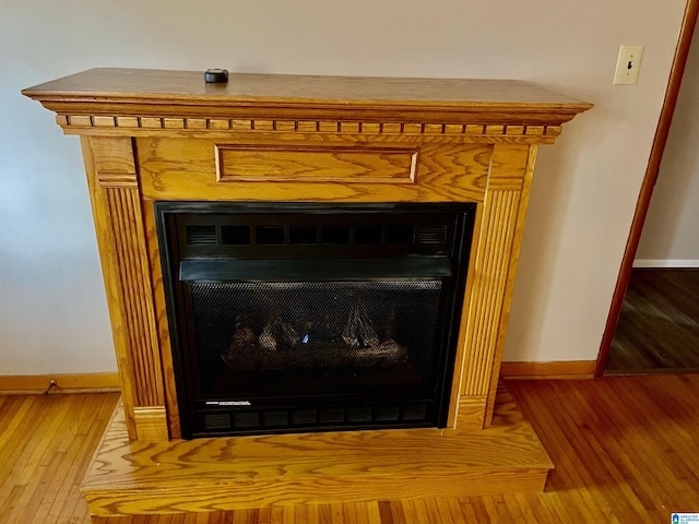 interior details featuring hardwood / wood-style flooring