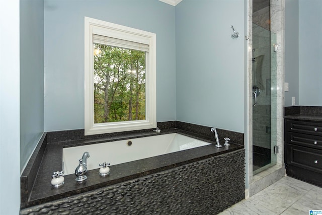 bathroom with shower with separate bathtub