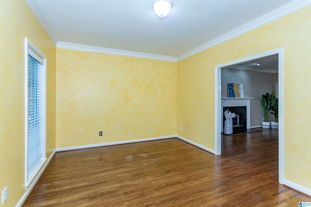 unfurnished room with dark hardwood / wood-style floors and crown molding