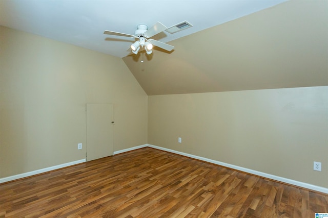 additional living space featuring wood-type flooring, ceiling fan, and lofted ceiling